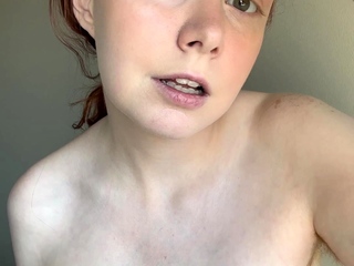 Amateur redhead Dasha with glasses masturbates